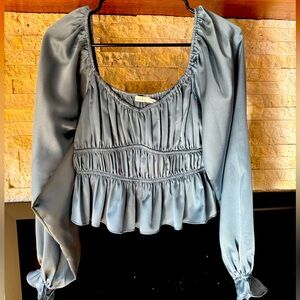 Never wore icy blue/grey top.